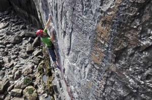 photograph of climber on a large expanse of vertical rock